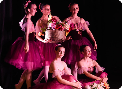 Ballerinas in purple costumes