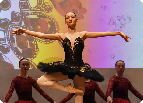 Ballerina in black tutu performing
